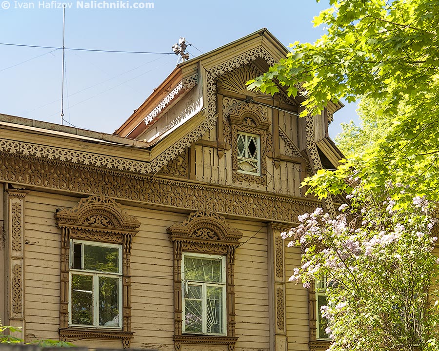 Beatiful wooden house with carved cornice