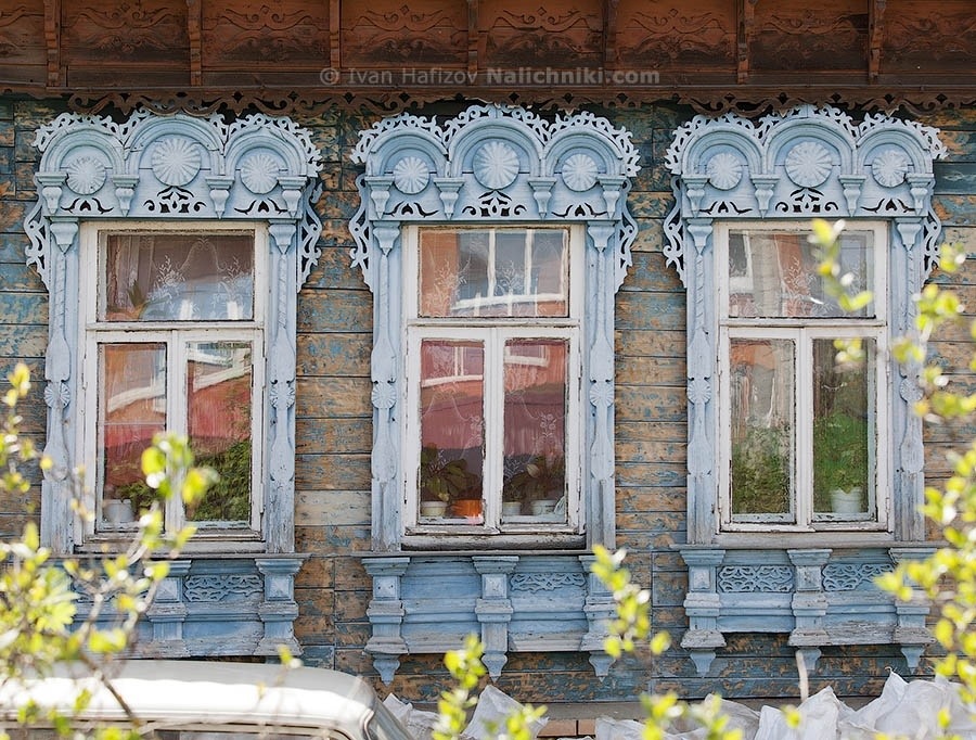 The nalichniki (ornate wooden windows frames) with typical three-arched roof in Yegoryevsk