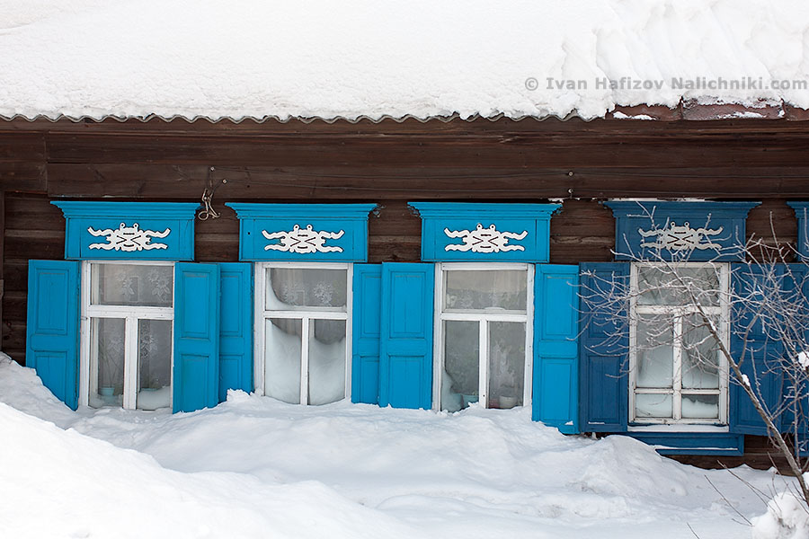 Windows covered with snow in Alapaevsk